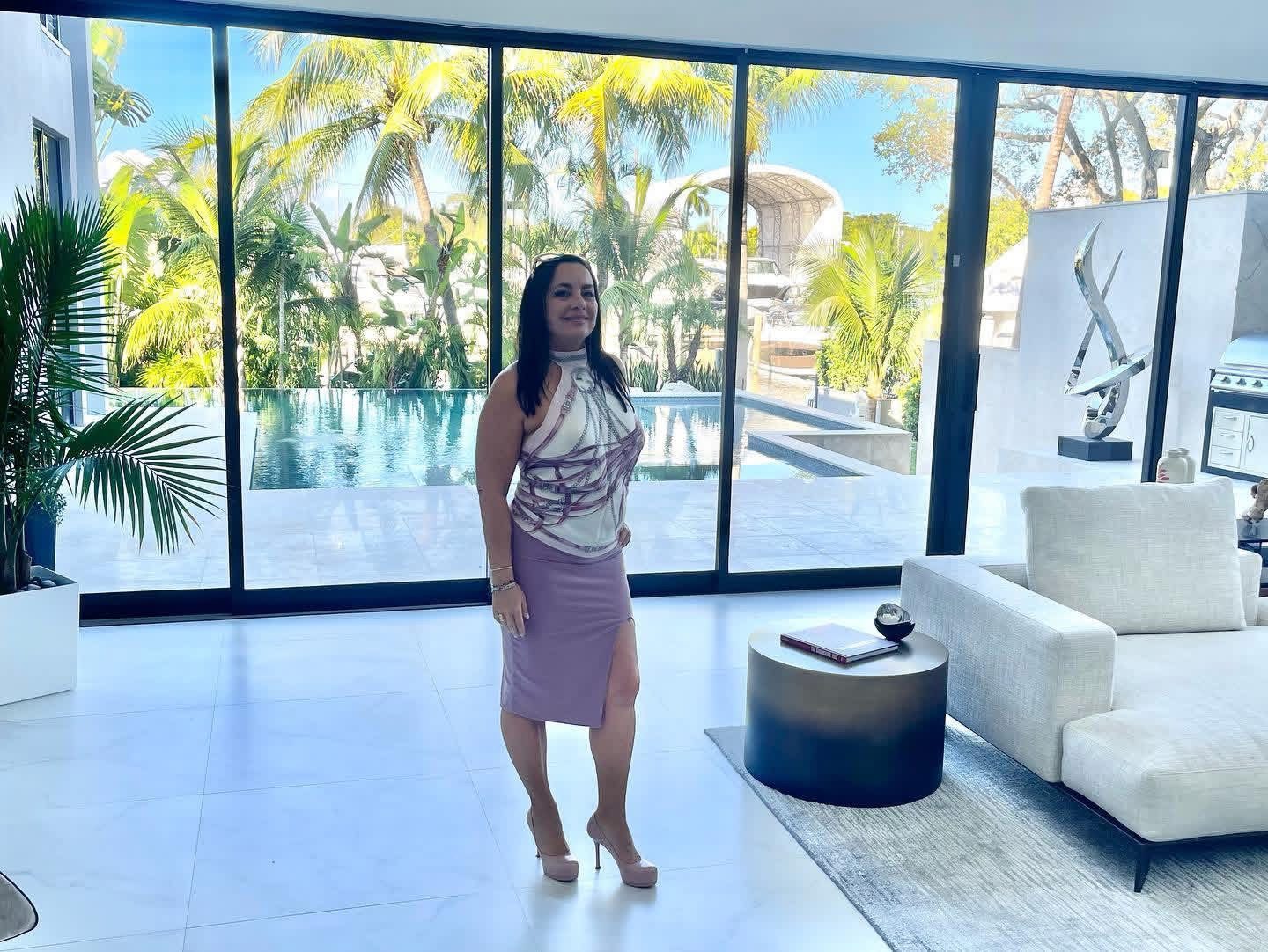 June Savage in the living room of a modern Miami waterfront home